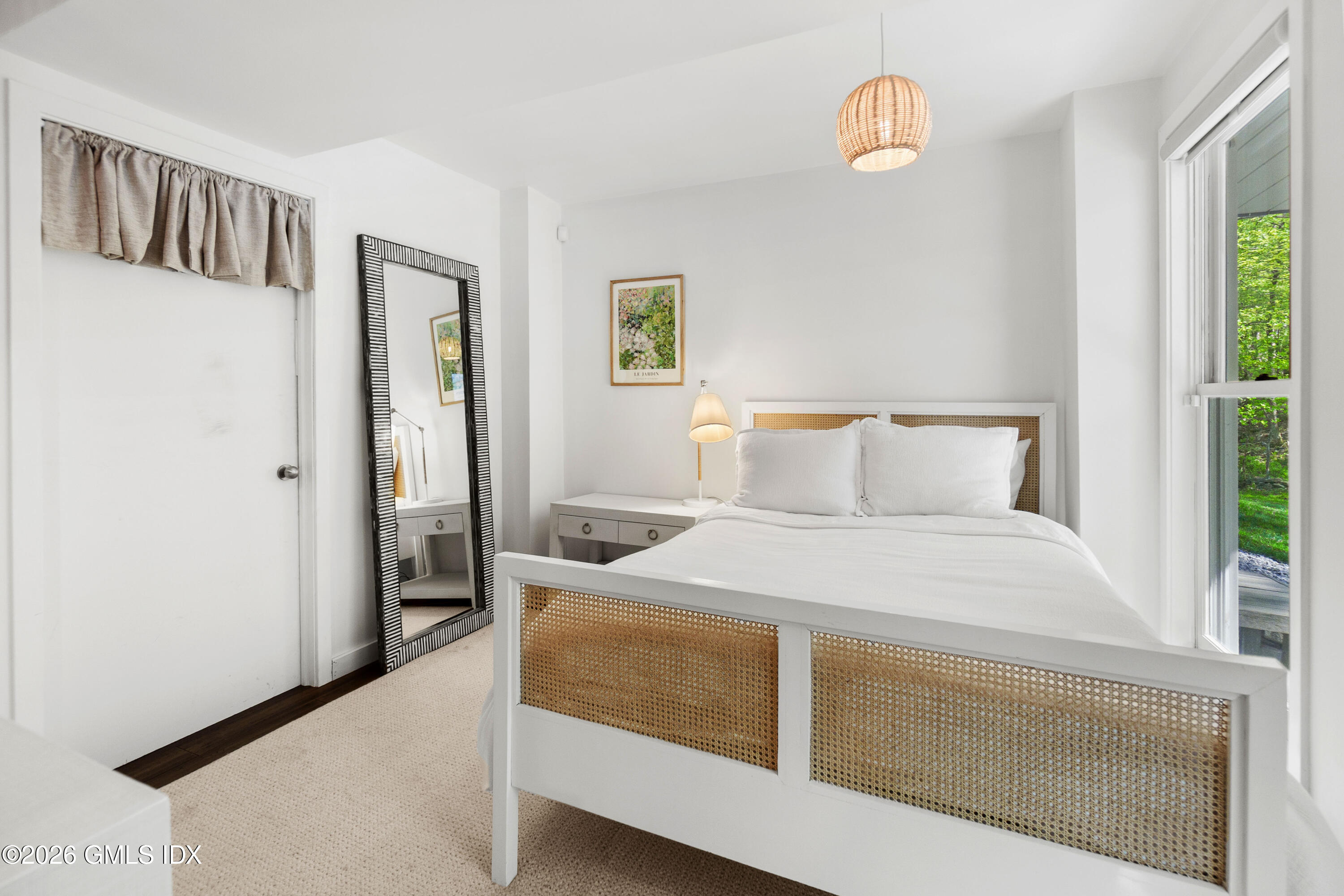 386 Taconic Road Greenwich, CT 06831 - Photo 17 of 22 a bedroom with a bed and a window