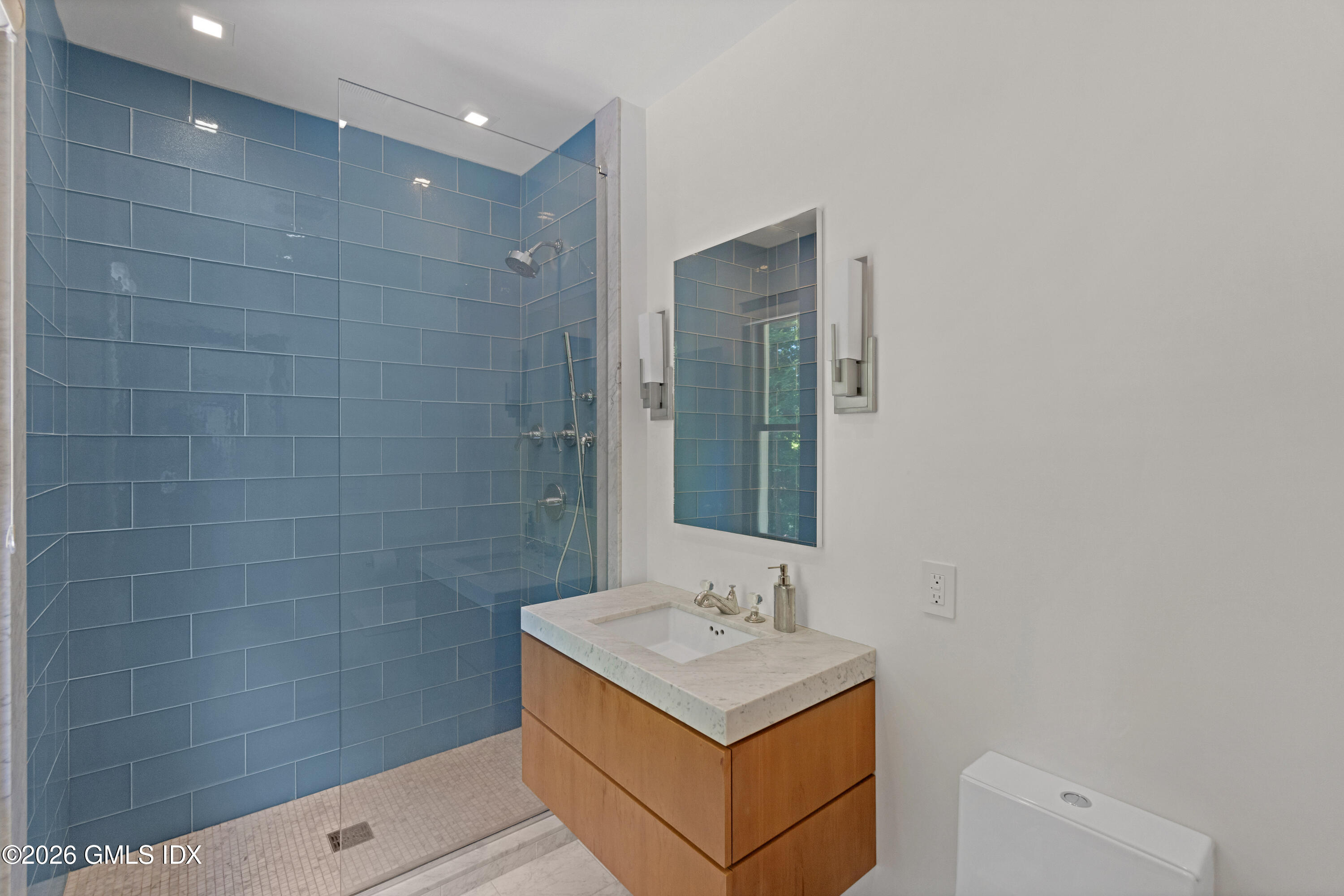 386 Taconic Road Greenwich, CT 06831 - Photo 18 of 22 a bathroom with a sink a toilet and shower