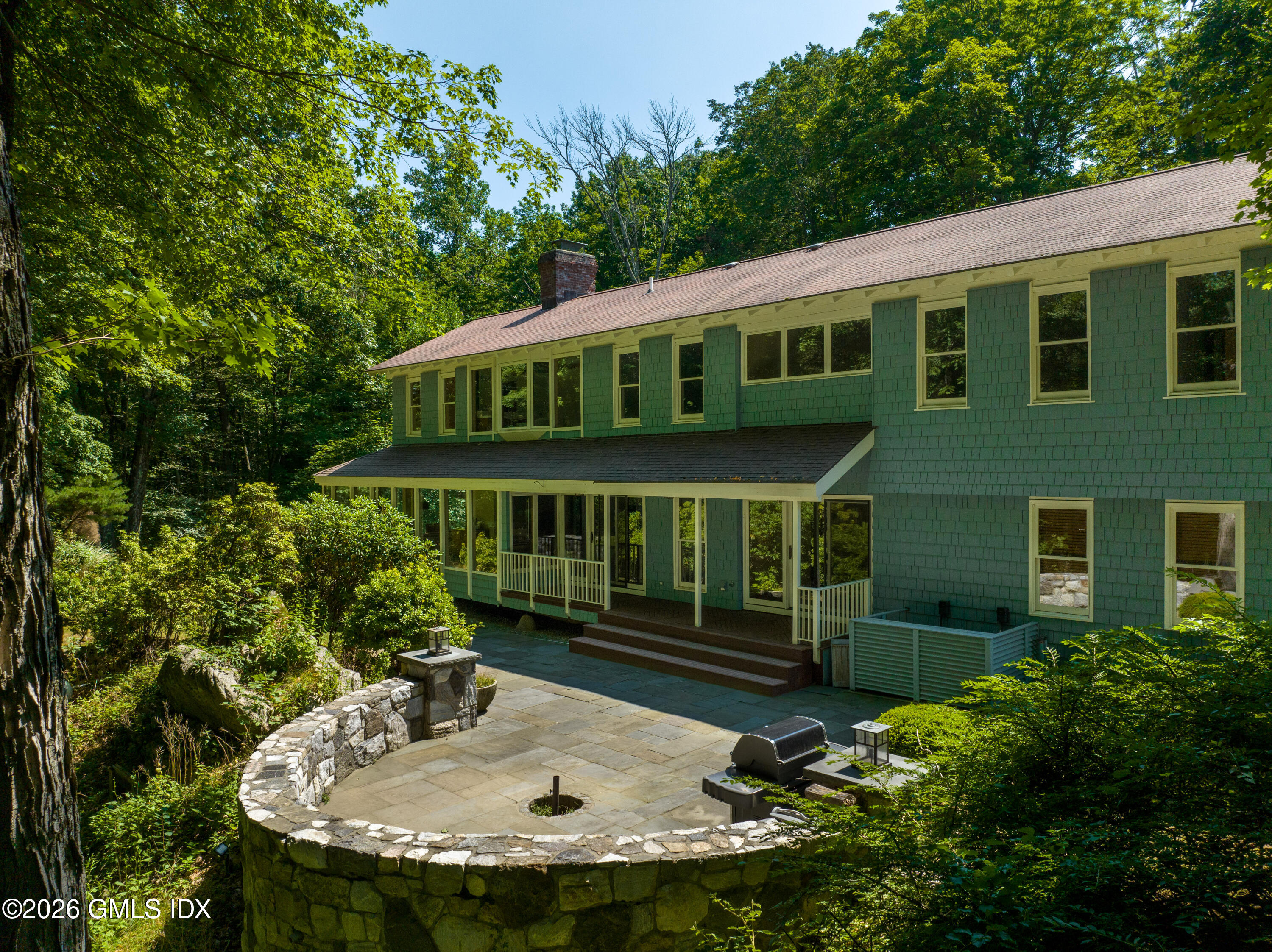 386 Taconic Road Greenwich, CT 06831 - Photo 20 of 22 a front view of a house with garden