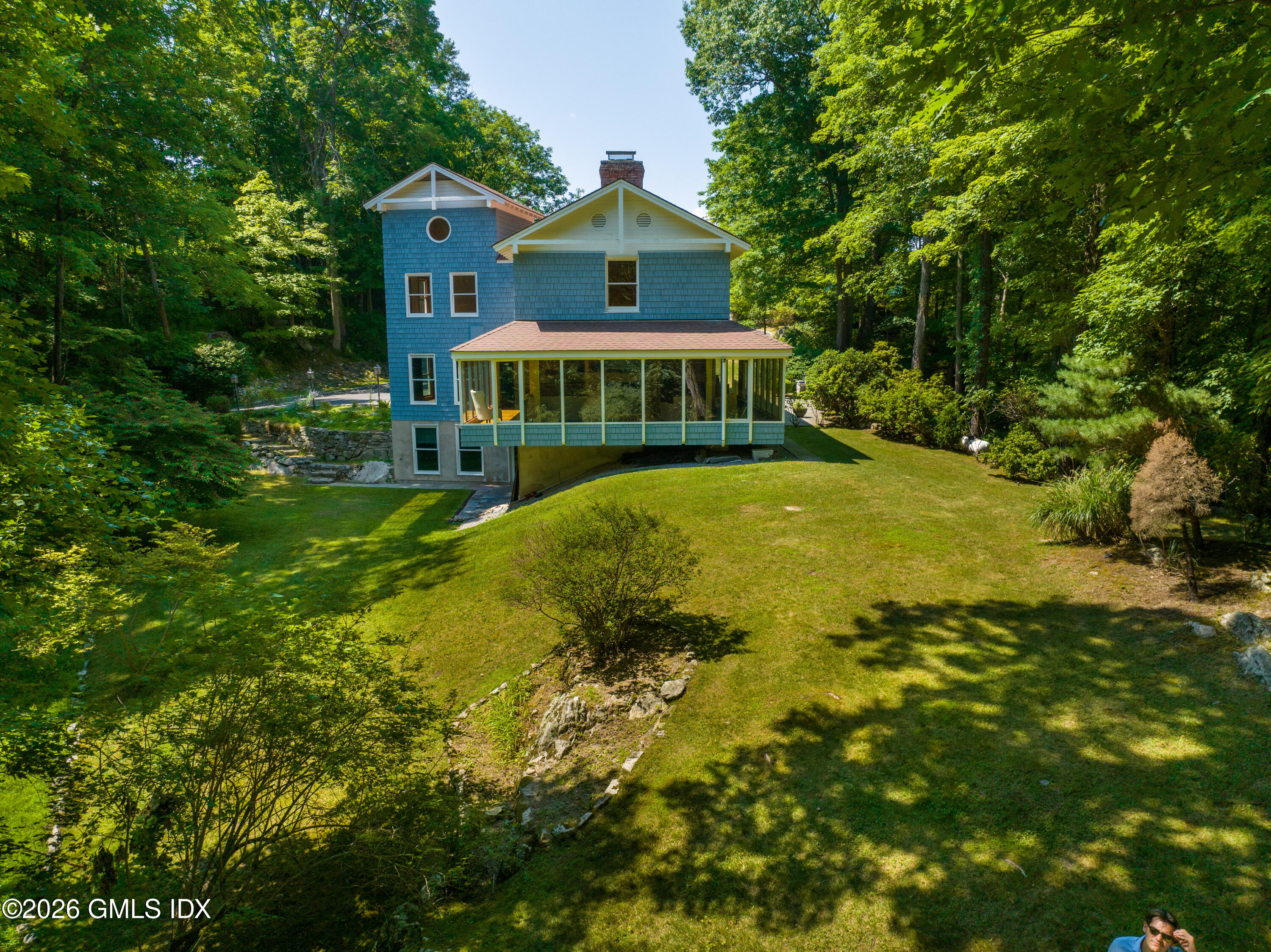 386 Taconic Road Greenwich, CT 06831 - Photo 21 of 22 a view of a house with a garden