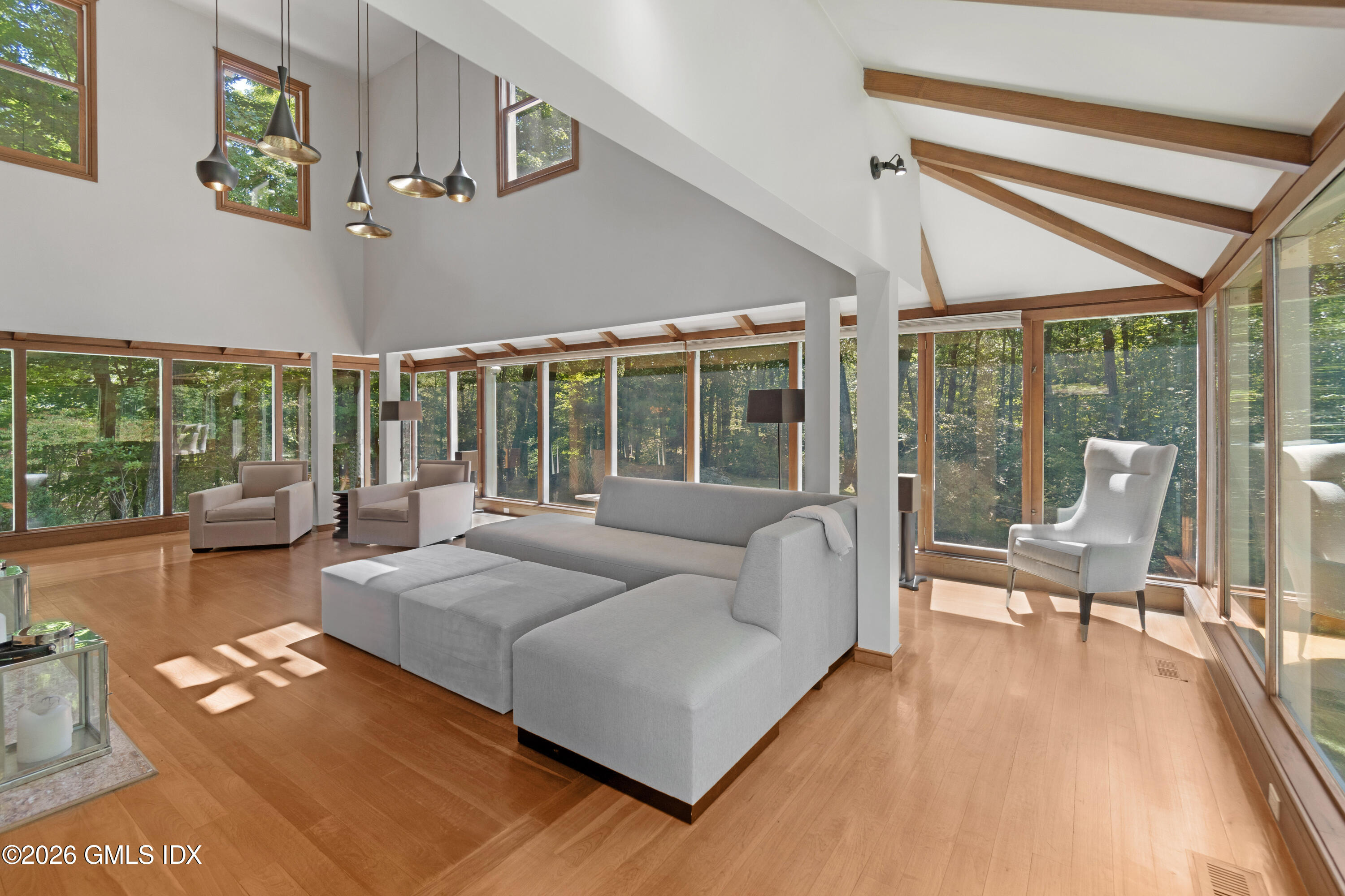 386 Taconic Road Greenwich, CT 06831 - Photo 3 of 22 a living room with furniture and a large window