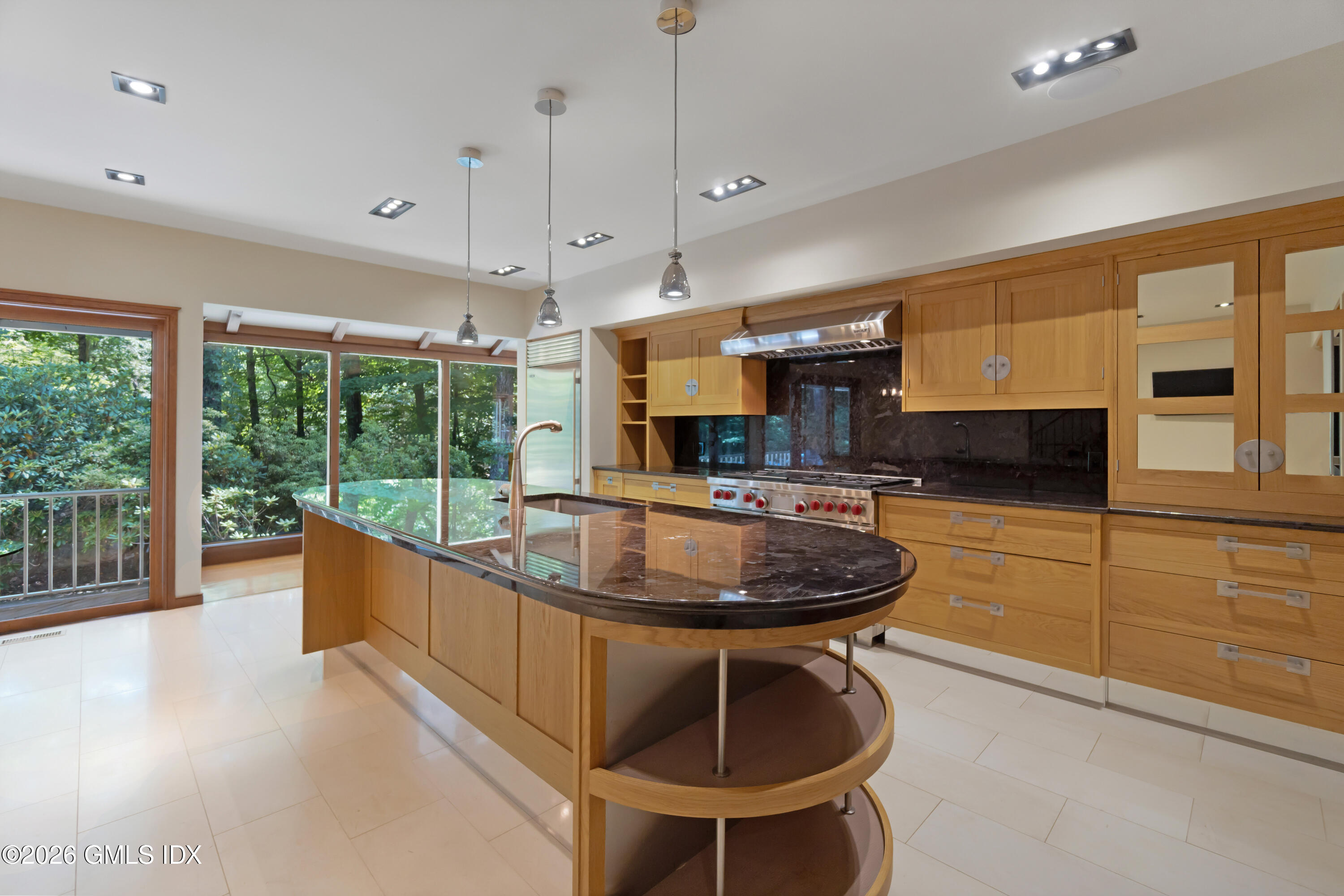 386 Taconic Road Greenwich, CT 06831 - Photo 7 of 22 a kitchen with sink a stove and chairs