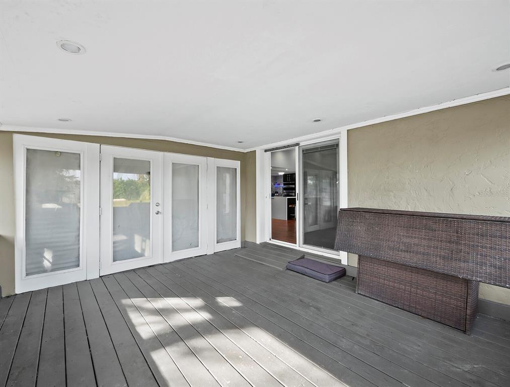 5645 Churchill Downs Road Sarasota, FL 34241 - Photo 16 of 41 a view of an empty room with wooden floor and a window