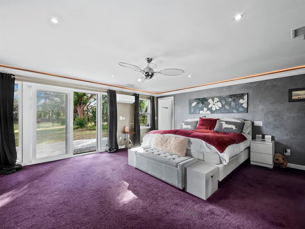 5645 Churchill Downs Road Sarasota, FL 34241 - Photo 18 of 41 a living room with furniture large window and flat screen tv