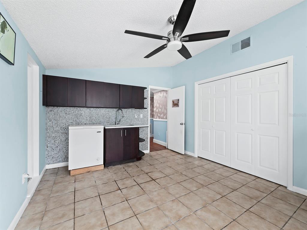 5645 Churchill Downs Road Sarasota, FL 34241 - Photo 24 of 41 a view of a kitchen with a sink and a refrigerator