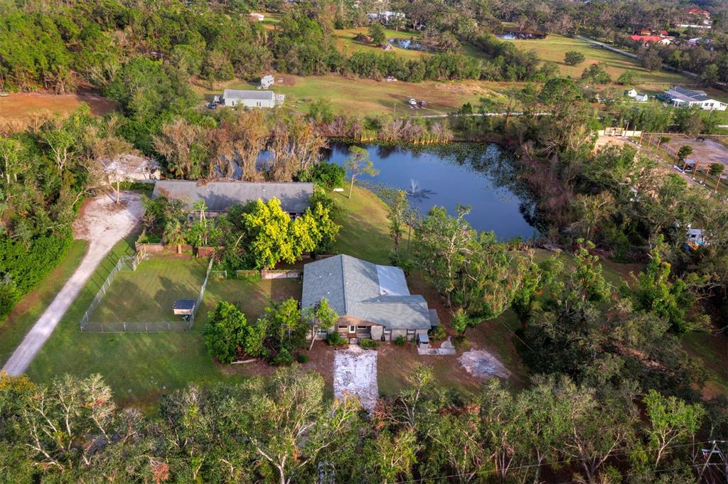 5645 Churchill Downs Road Sarasota, FL 34241 - Photo 40 of 41 an aerial view of residential houses with outdoor space and trees