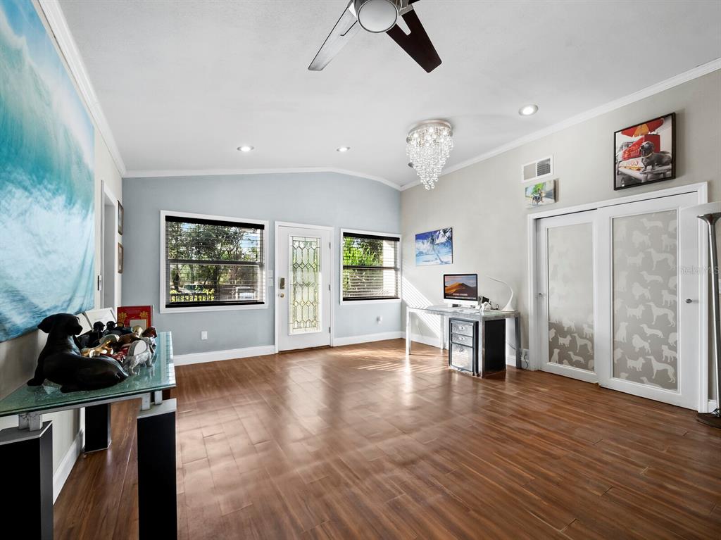 5645 Churchill Downs Road Sarasota, FL 34241 - Photo 4 of 41 a living room with furniture and a large window