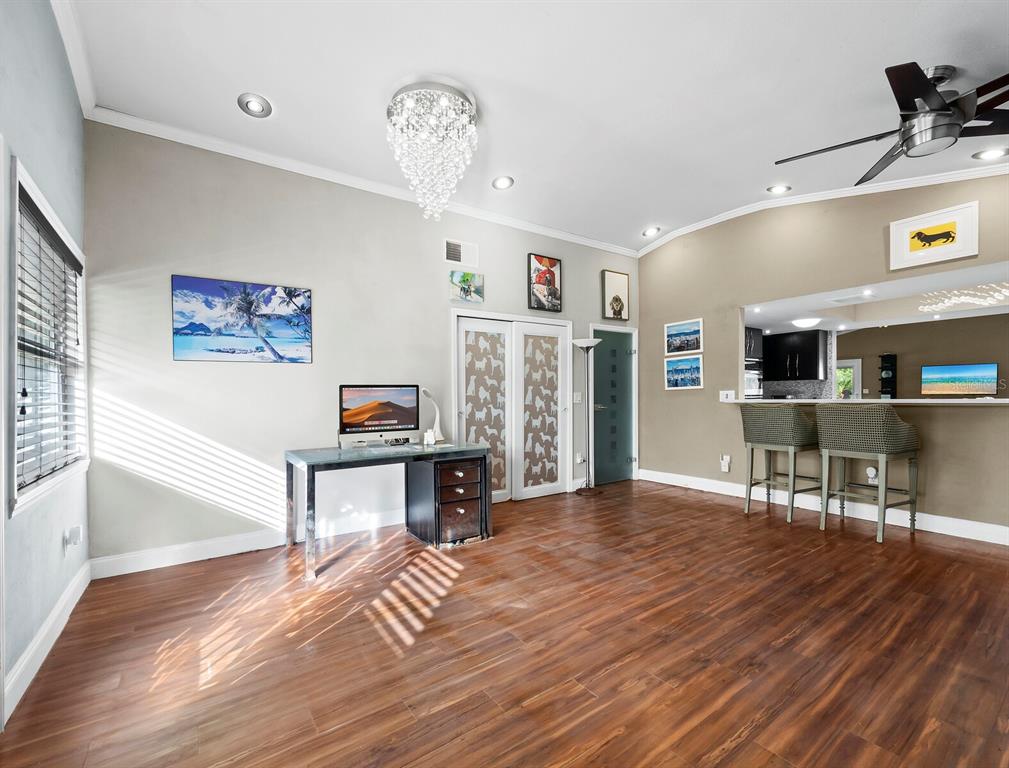 5645 Churchill Downs Road Sarasota, FL 34241 - Photo 5 of 41 a living room with furniture and a wooden floor