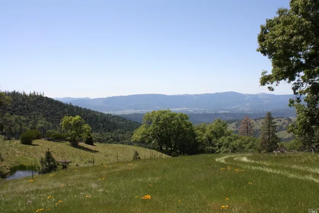 a view of a town with mountains in the background