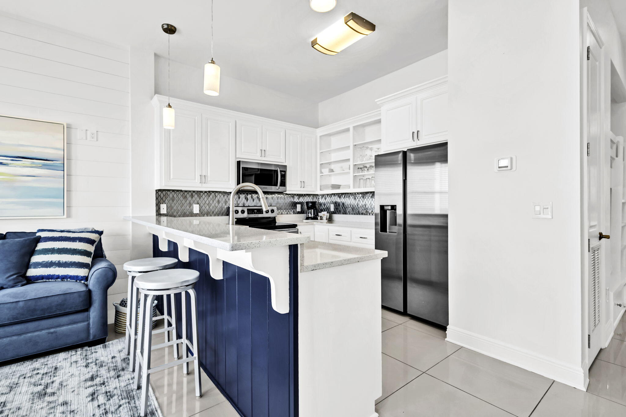 613 Eastern Lake Road, Unit 3 Santa Rosa Beach, FL 32459 - Photo 12 of 38 a kitchen with stainless steel appliances granite countertop a refrigerator stove microwave and sink