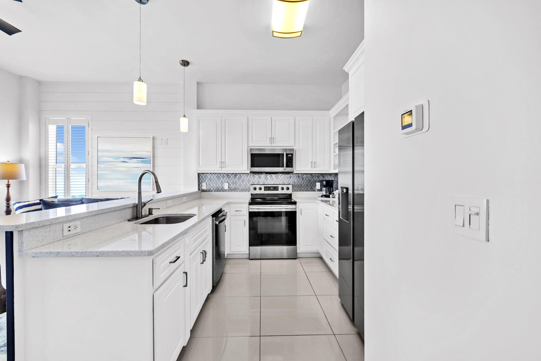 613 Eastern Lake Road, Unit 3 Santa Rosa Beach, FL 32459 - Photo 15 of 38 a kitchen with granite countertop a sink stainless steel appliances and cabinets