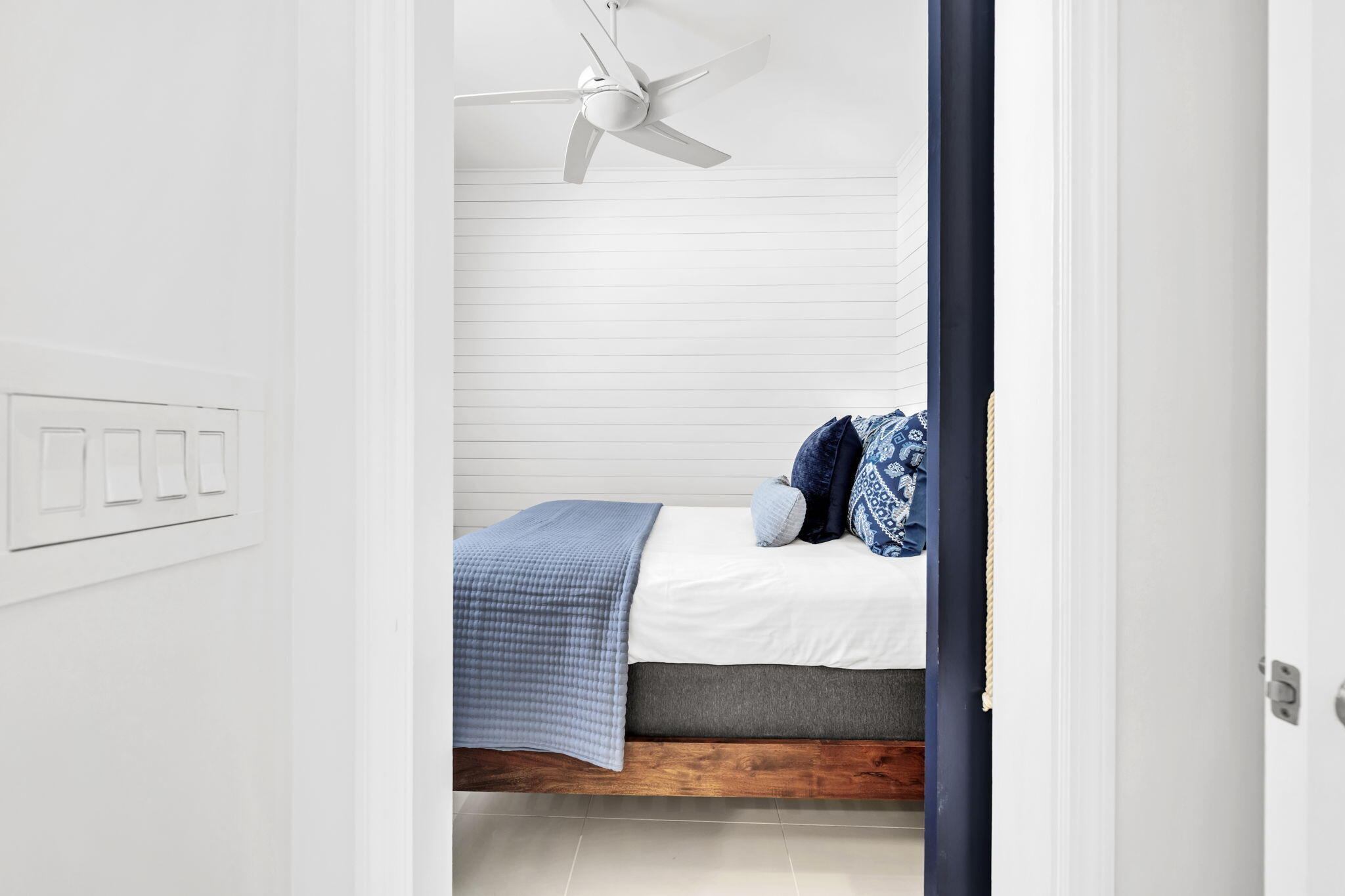 613 Eastern Lake Road, Unit 3 Santa Rosa Beach, FL 32459 - Photo 17 of 38 a bedroom with a bed and a chandelier