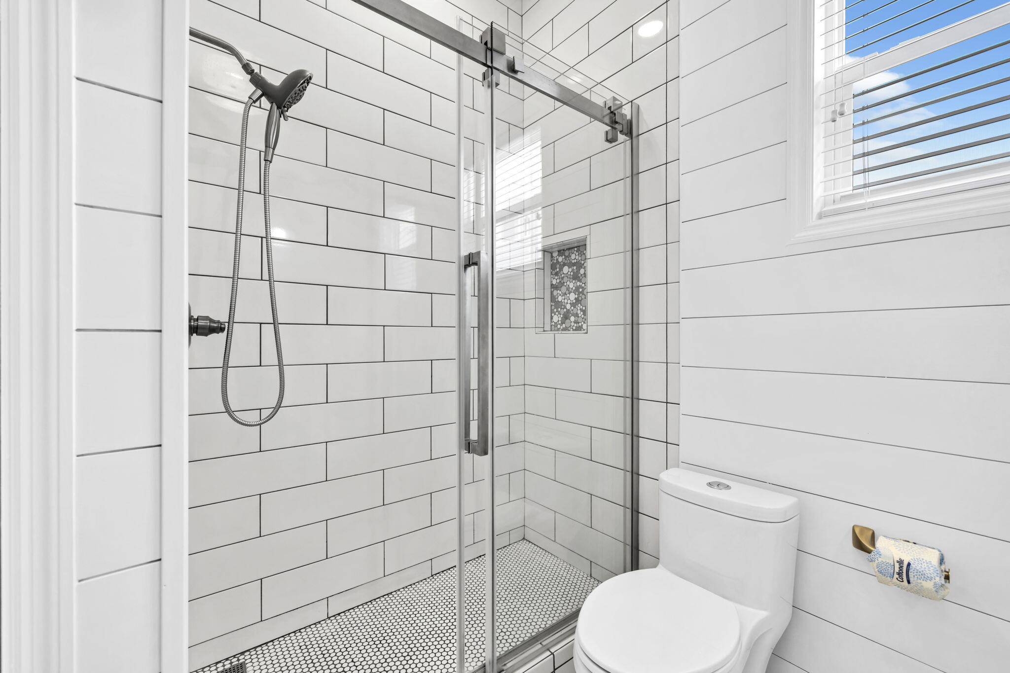 613 Eastern Lake Road, Unit 3 Santa Rosa Beach, FL 32459 - Photo 23 of 38 a bathroom with a toilet and a shower