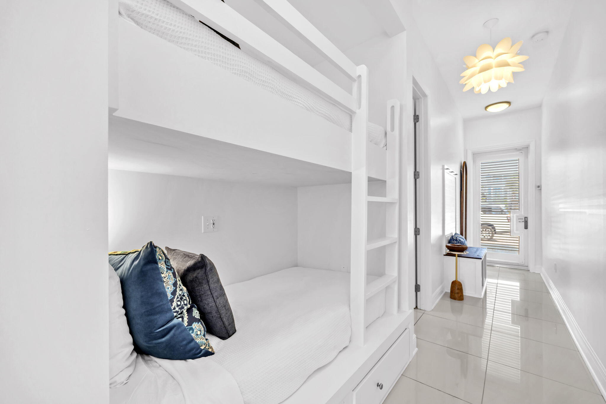 613 Eastern Lake Road, Unit 3 Santa Rosa Beach, FL 32459 - Photo 27 of 38 a view of a living room with furniture and a chandelier
