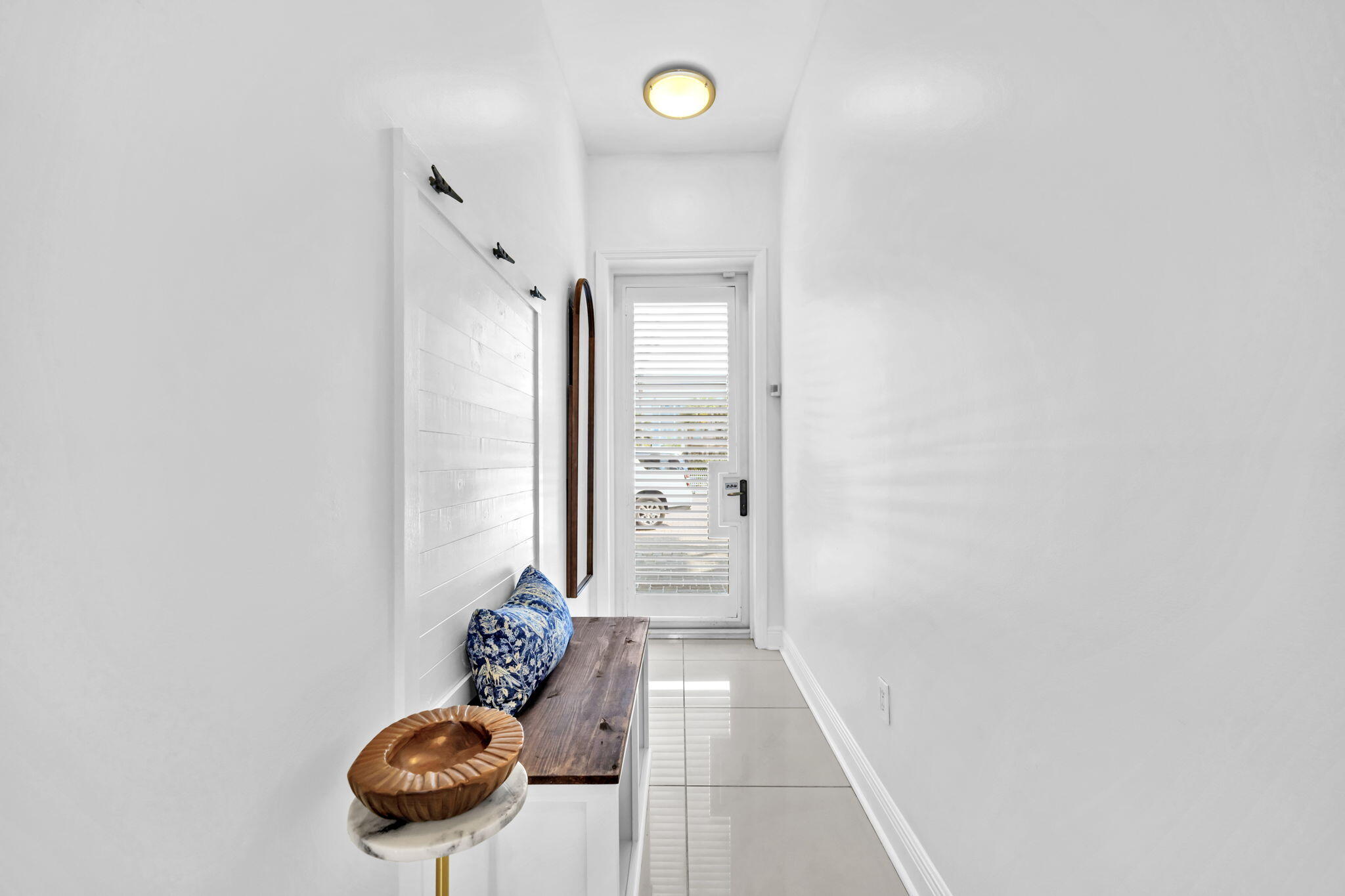 613 Eastern Lake Road, Unit 3 Santa Rosa Beach, FL 32459 - Photo 29 of 38 a view of a hallway to a room with windows