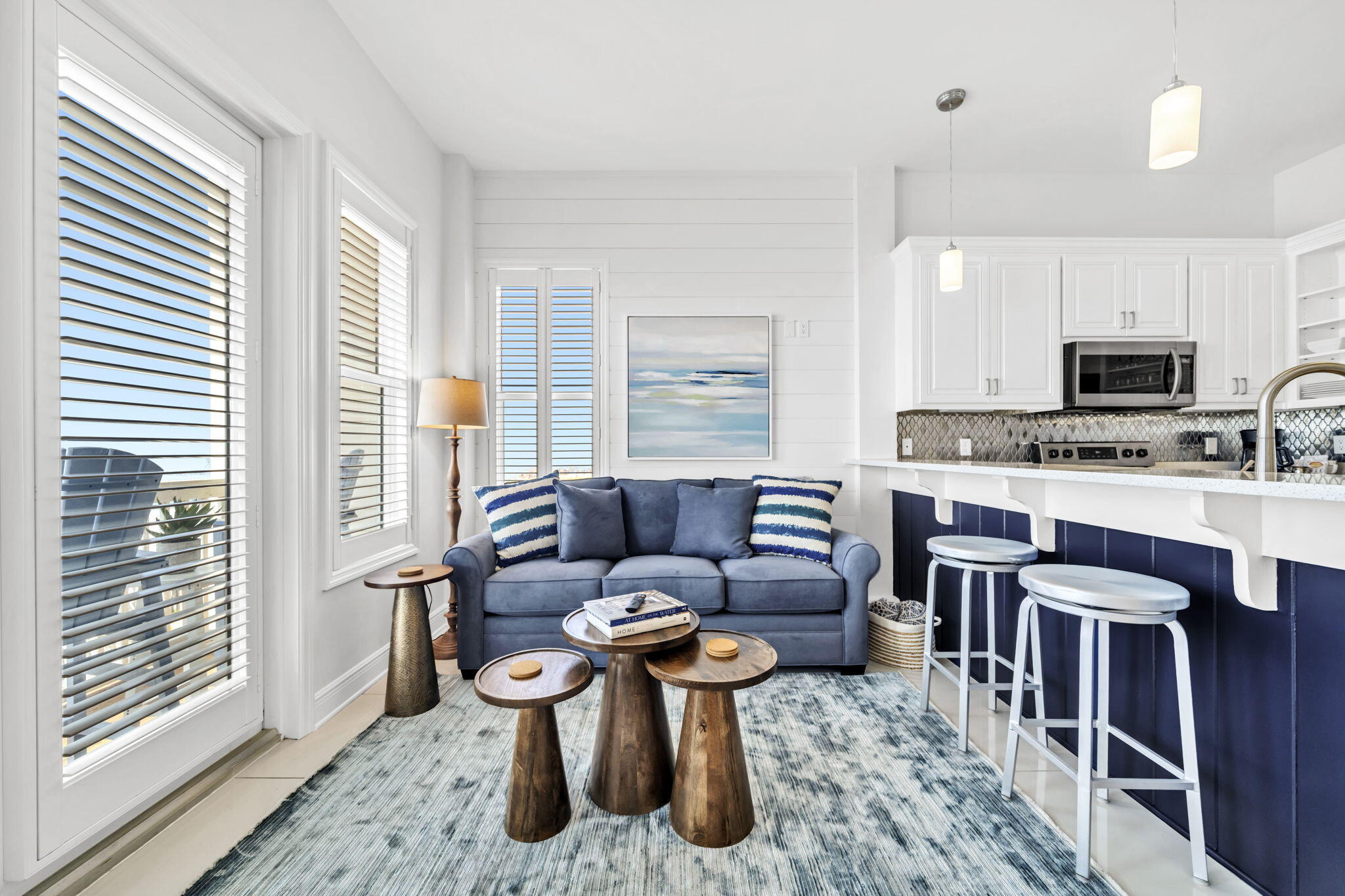 613 Eastern Lake Road, Unit 3 Santa Rosa Beach, FL 32459 - Photo 7 of 38 a living room with furniture a large window and a fireplace