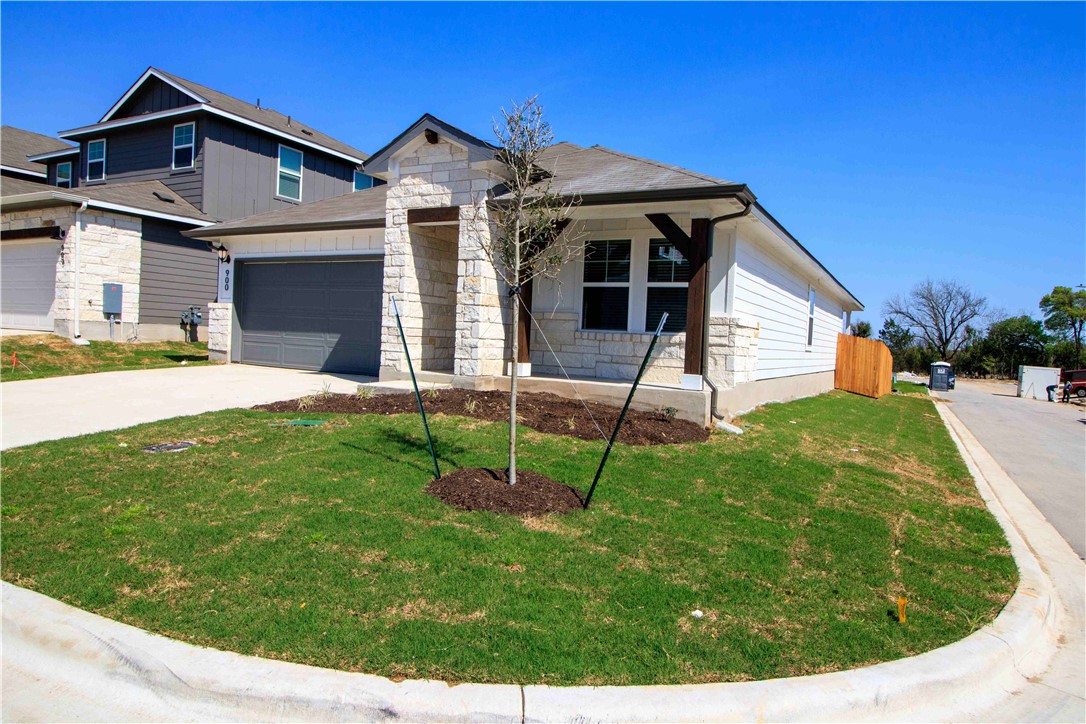 a view of a house with a yard