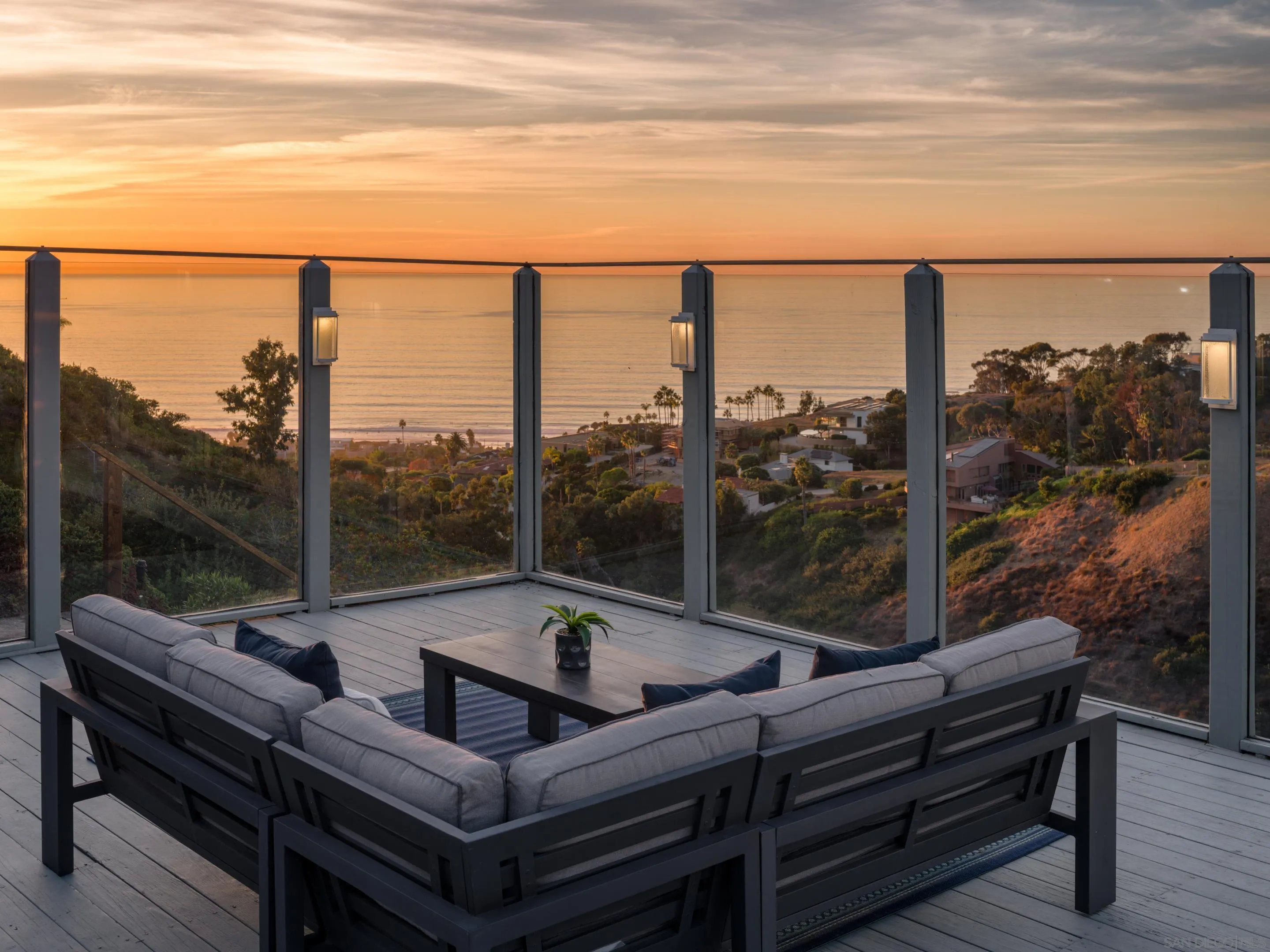 a view of a balcony with chairs