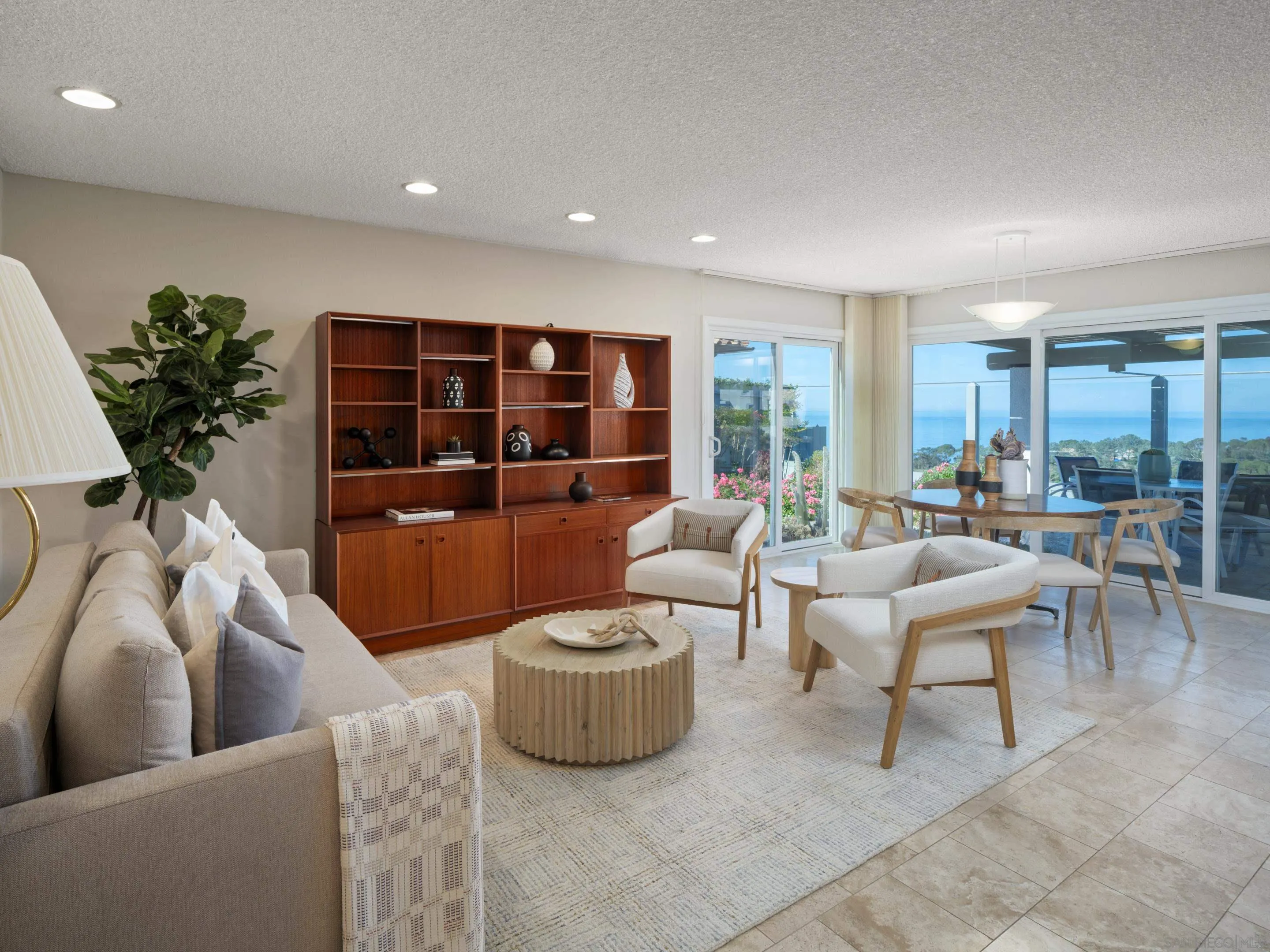 8568 Prestwick Drive La Jolla, CA 92037 - Photo 15 of 39 a living room with furniture and a large window