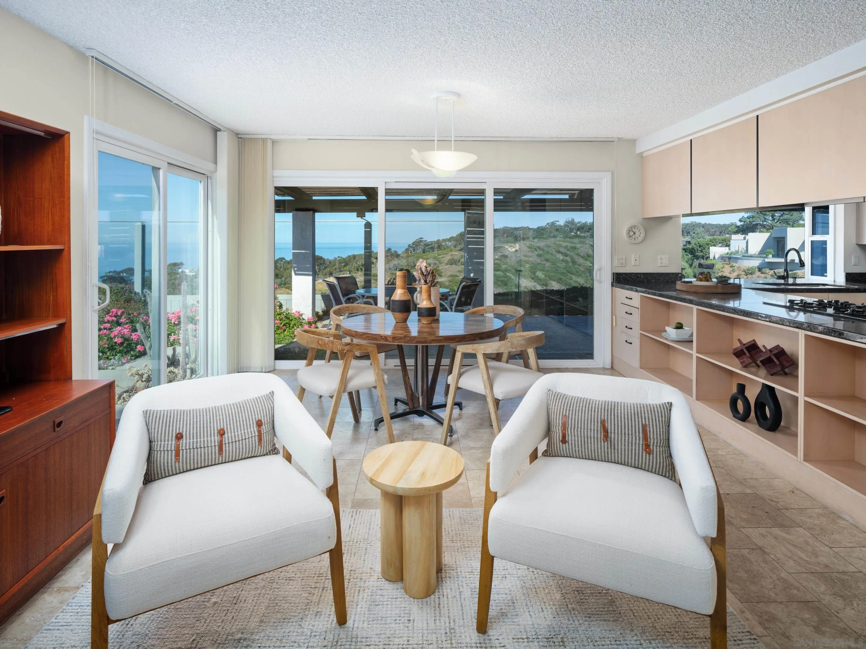 8568 Prestwick Drive La Jolla, CA 92037 - Photo 16 of 39 a living room with furniture and a large window
