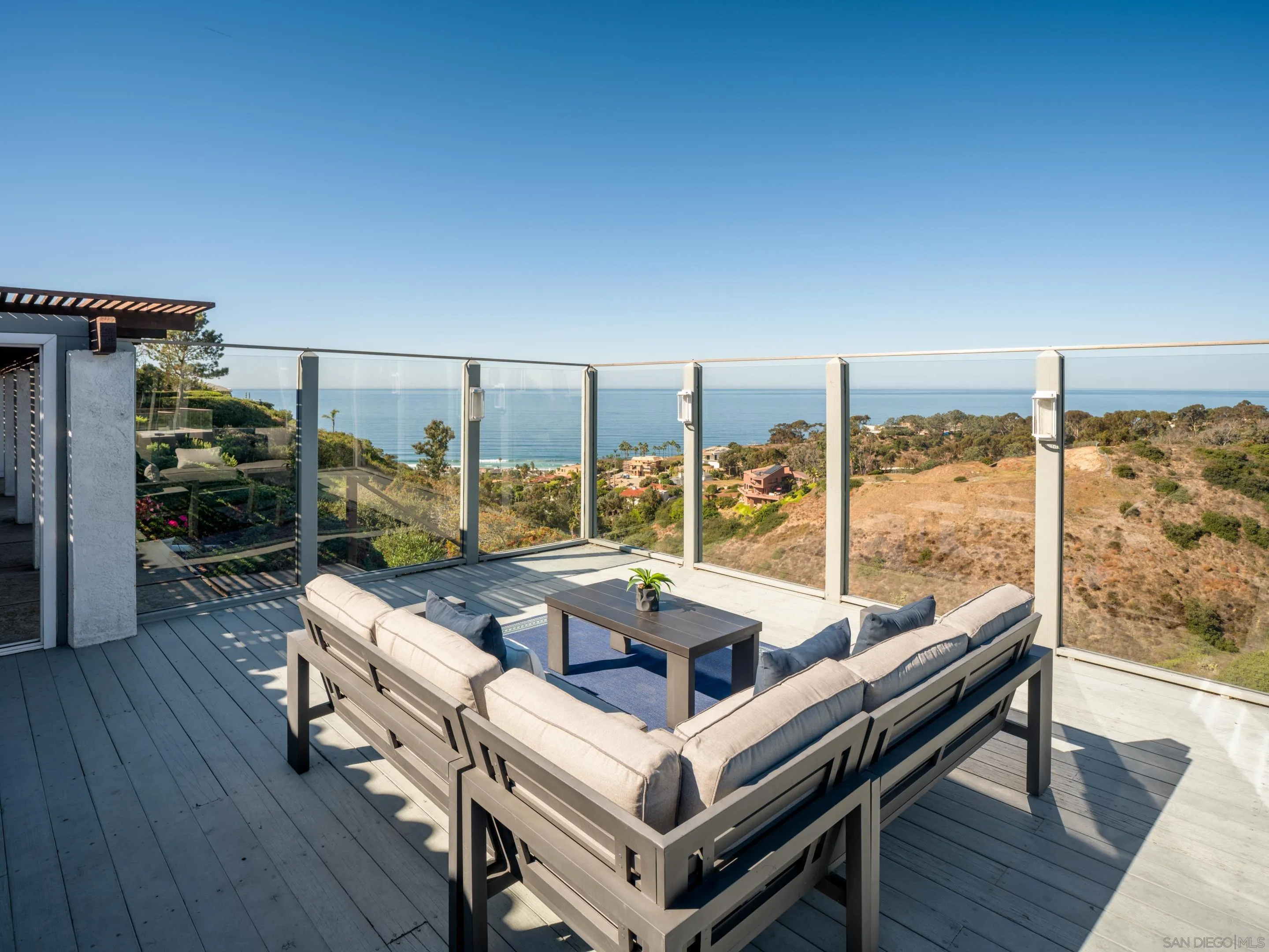 8568 Prestwick Drive La Jolla, CA 92037 - Photo 21 of 39 a living room with couch a table and chairs