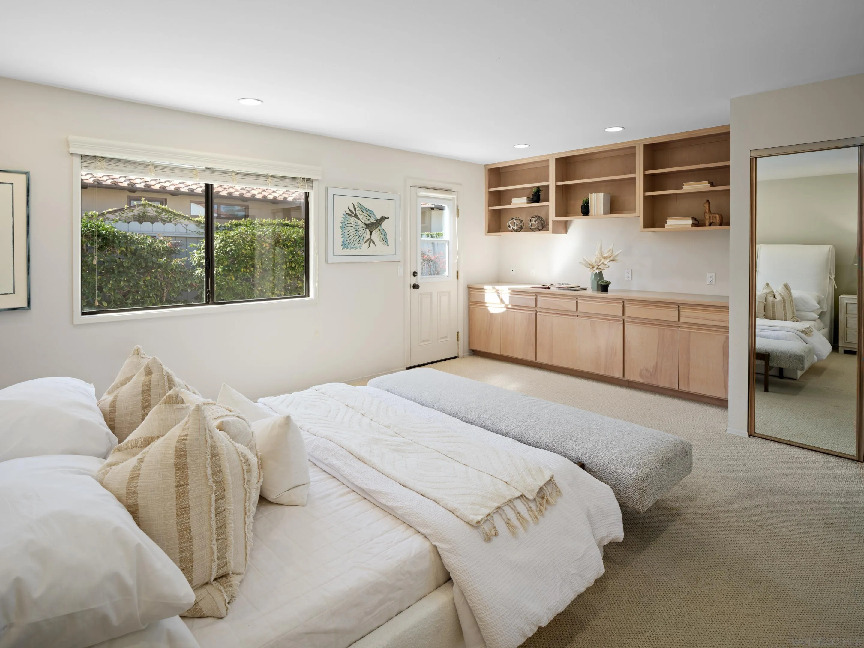 8568 Prestwick Drive La Jolla, CA 92037 - Photo 27 of 39 a bedroom with a large bed and a window