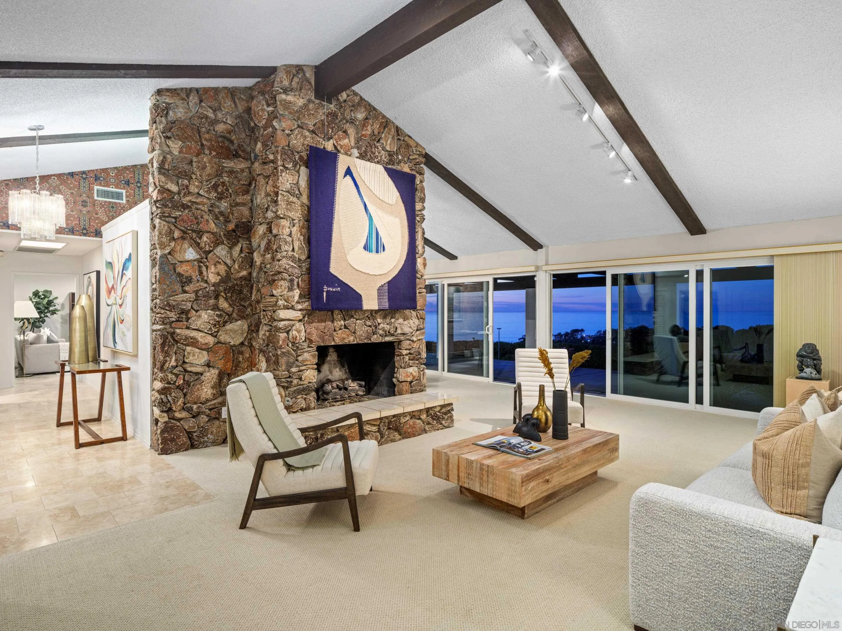 8568 Prestwick Drive La Jolla, CA 92037 - Photo 29 of 39 a living room with furniture and a fireplace