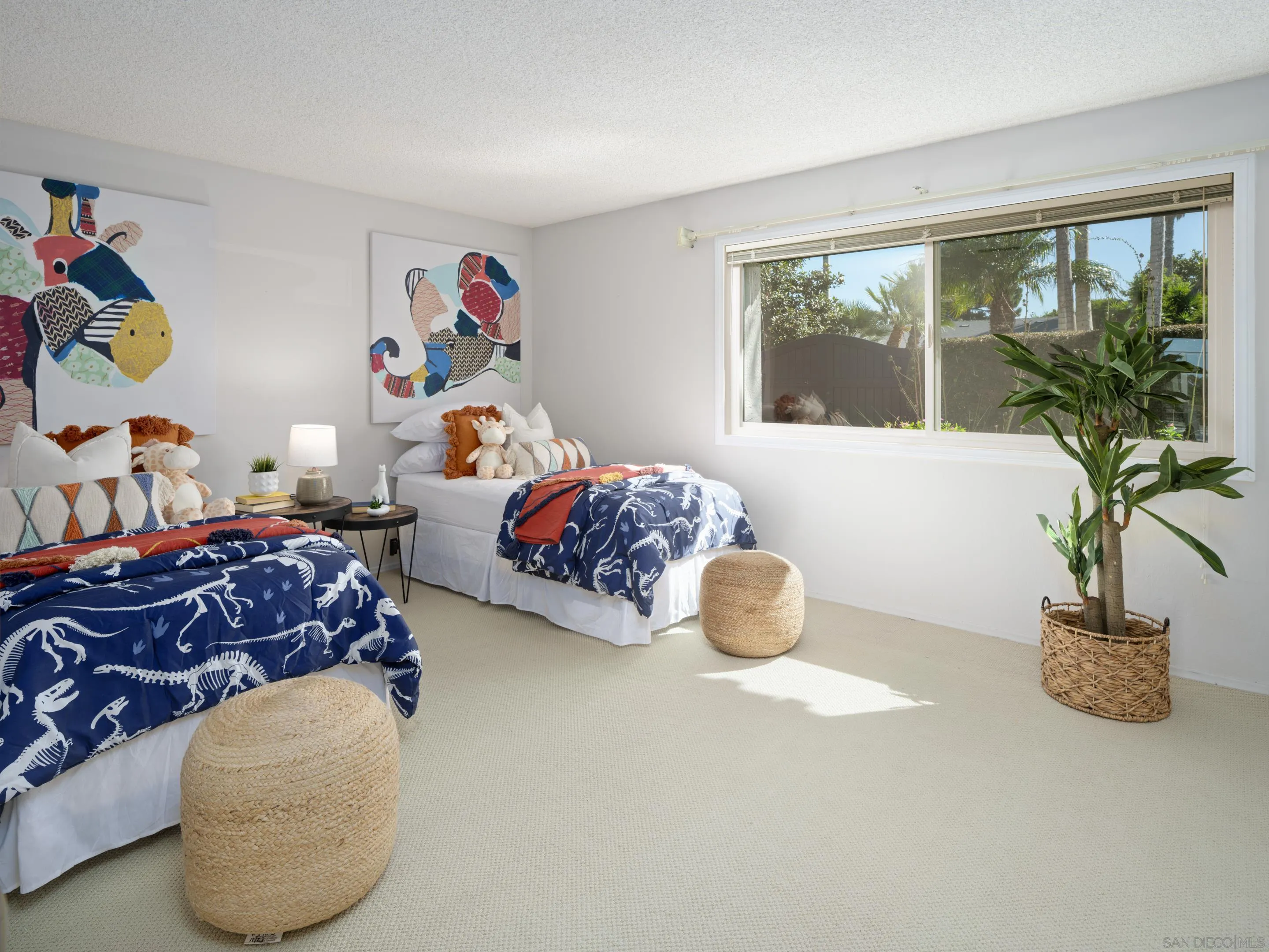 8568 Prestwick Drive La Jolla, CA 92037 - Photo 32 of 39 a bedroom with furniture and a potted plant