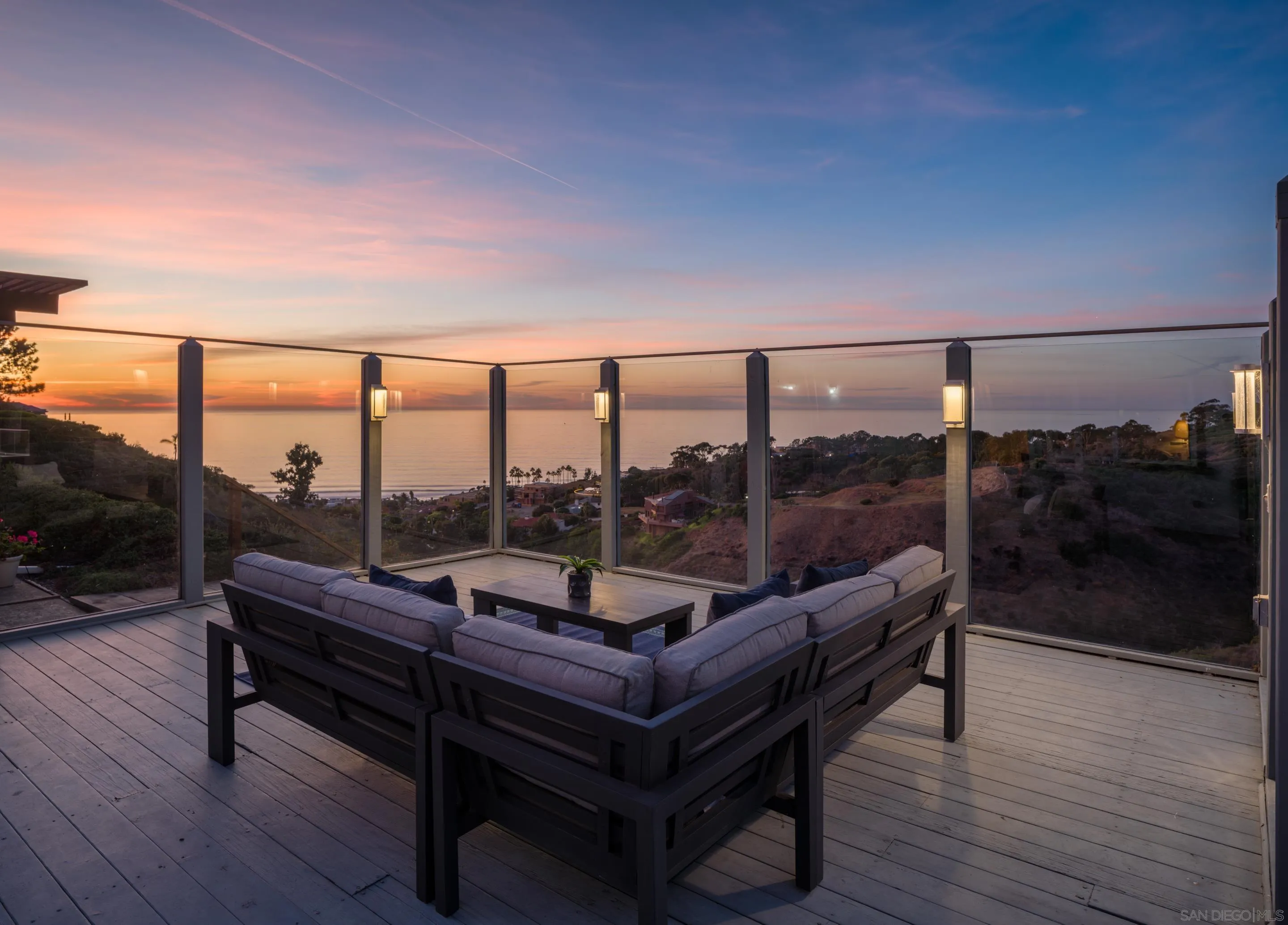 8568 Prestwick Drive La Jolla, CA 92037 - Photo 4 of 39 a living room with furniture and a floor to ceiling window