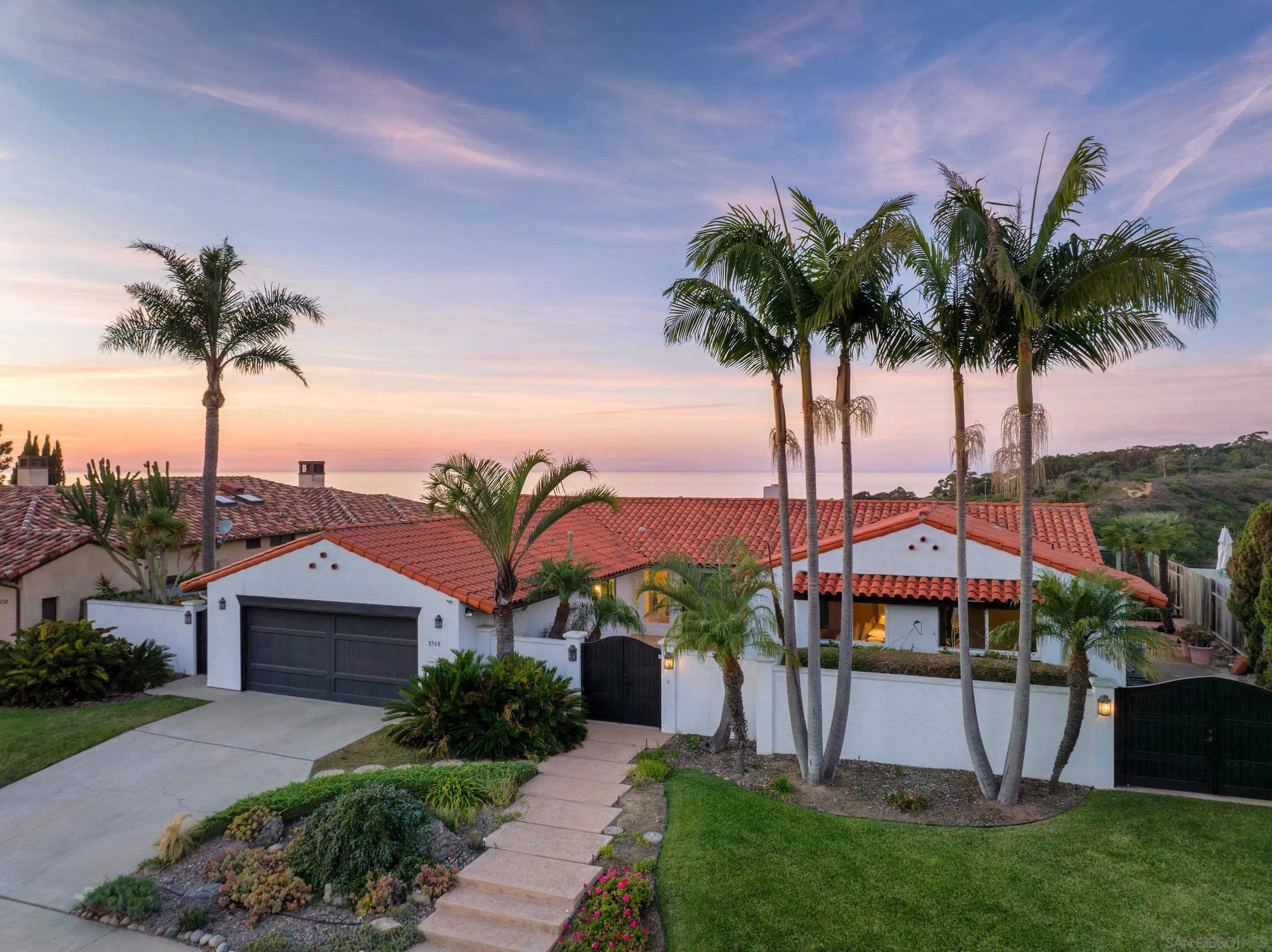 8568 Prestwick Drive La Jolla, CA 92037 - Photo 6 of 39 a view of a house with a yard and potted plants