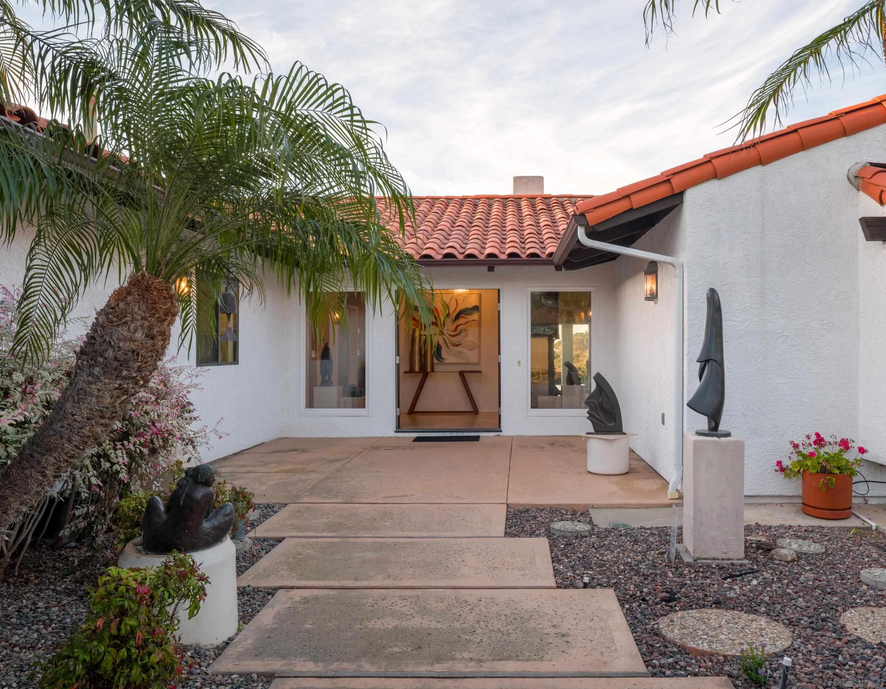 8568 Prestwick Drive La Jolla, CA 92037 - Photo 8 of 39 a front view of a house with garden