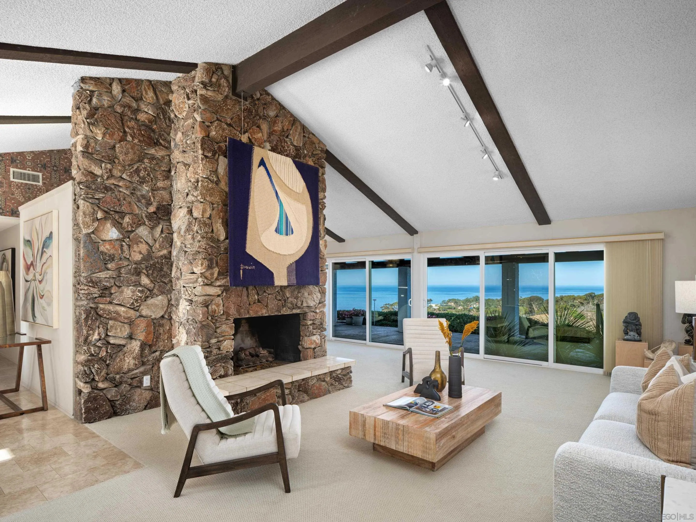 8568 Prestwick Drive La Jolla, CA 92037 - Photo 9 of 39 a living room with furniture and a fireplace