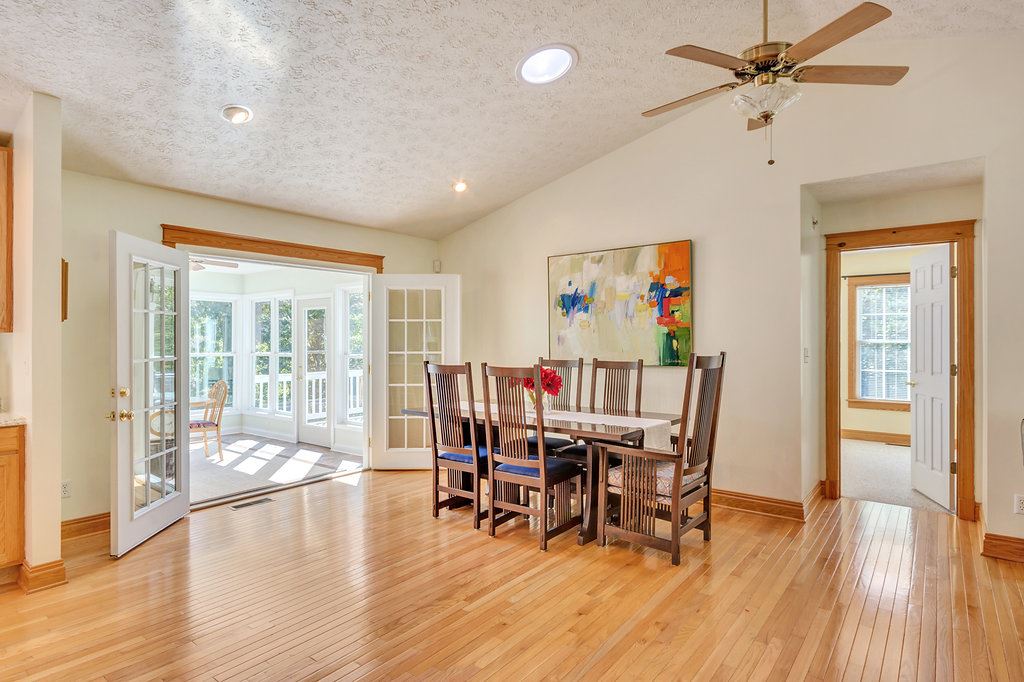 1452 Courthouse Road Palmyra, VA 22963 - Photo 18 of 44 a dining room with furniture wooden floor and a chandelier