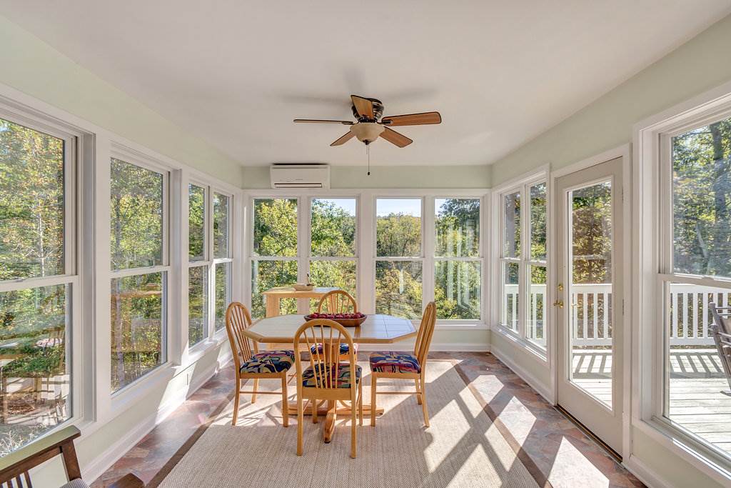 1452 Courthouse Road Palmyra, VA 22963 - Photo 22 of 44 a dining room with furniture water view and a floor to ceiling window