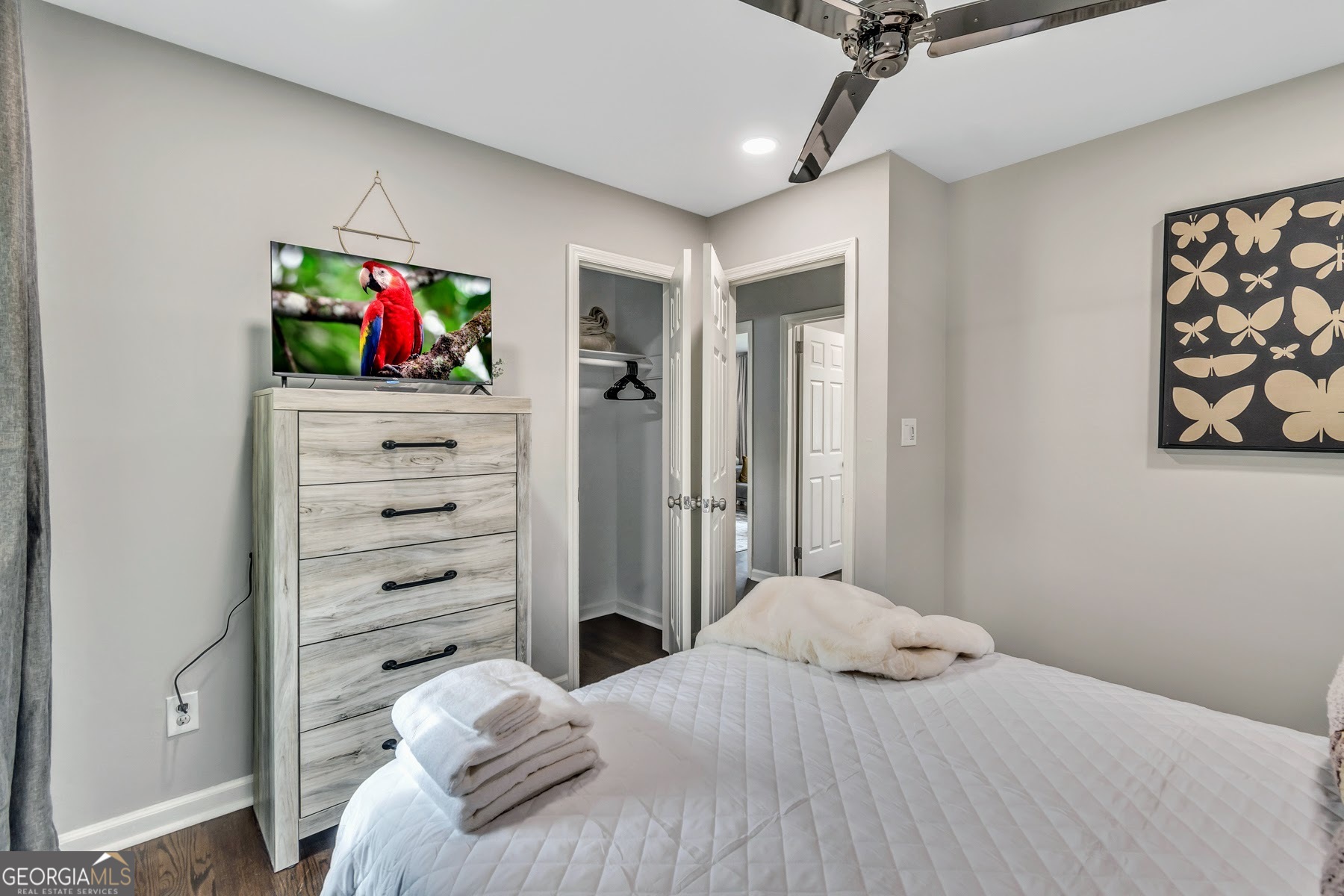 597 South Gordon Road Southwest Mableton, GA 30126 - Photo 18 of 25 a bedroom with a bed and a bookshelf