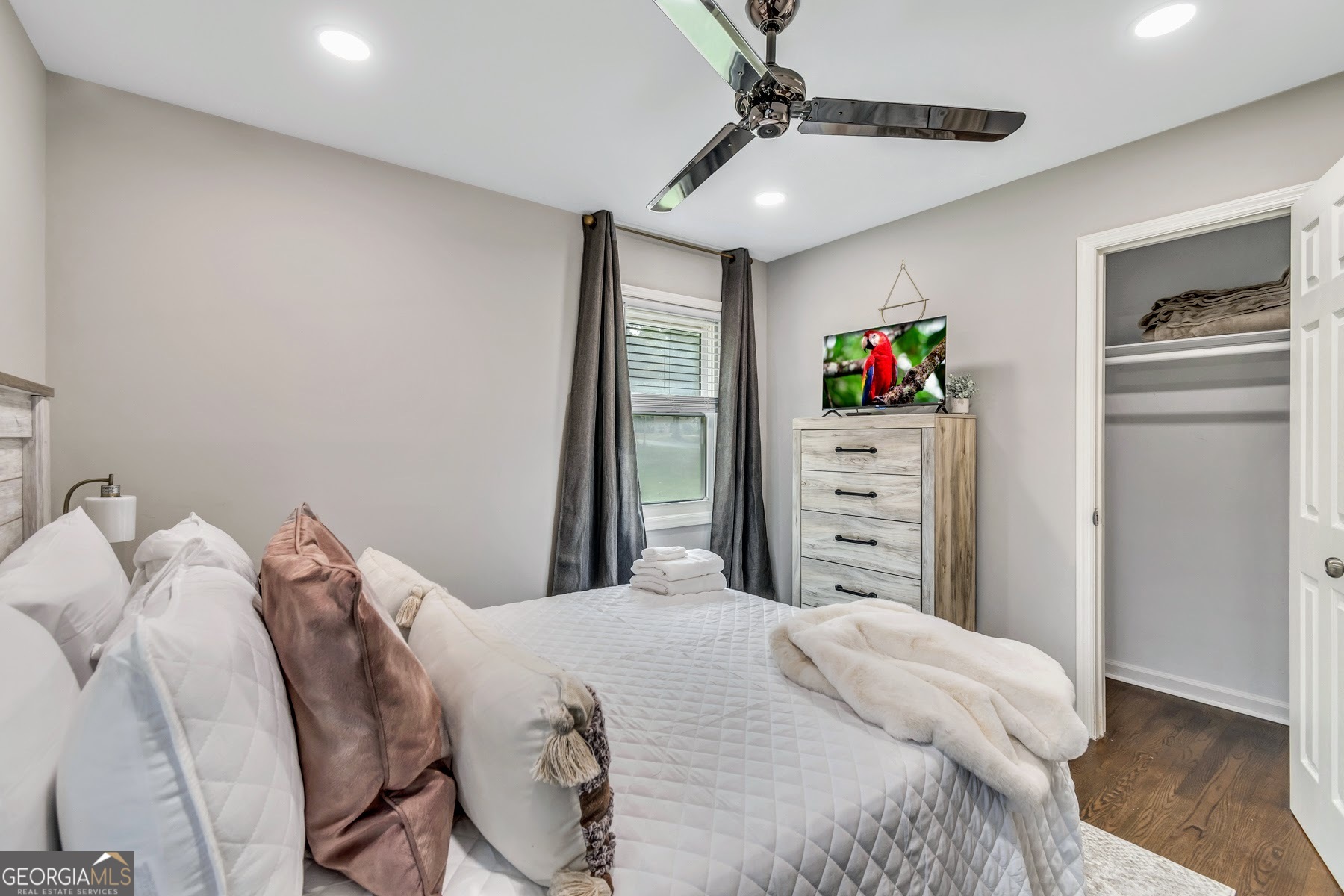 597 South Gordon Road Southwest Mableton, GA 30126 - Photo 19 of 25 a bedroom with a bed and a chandelier