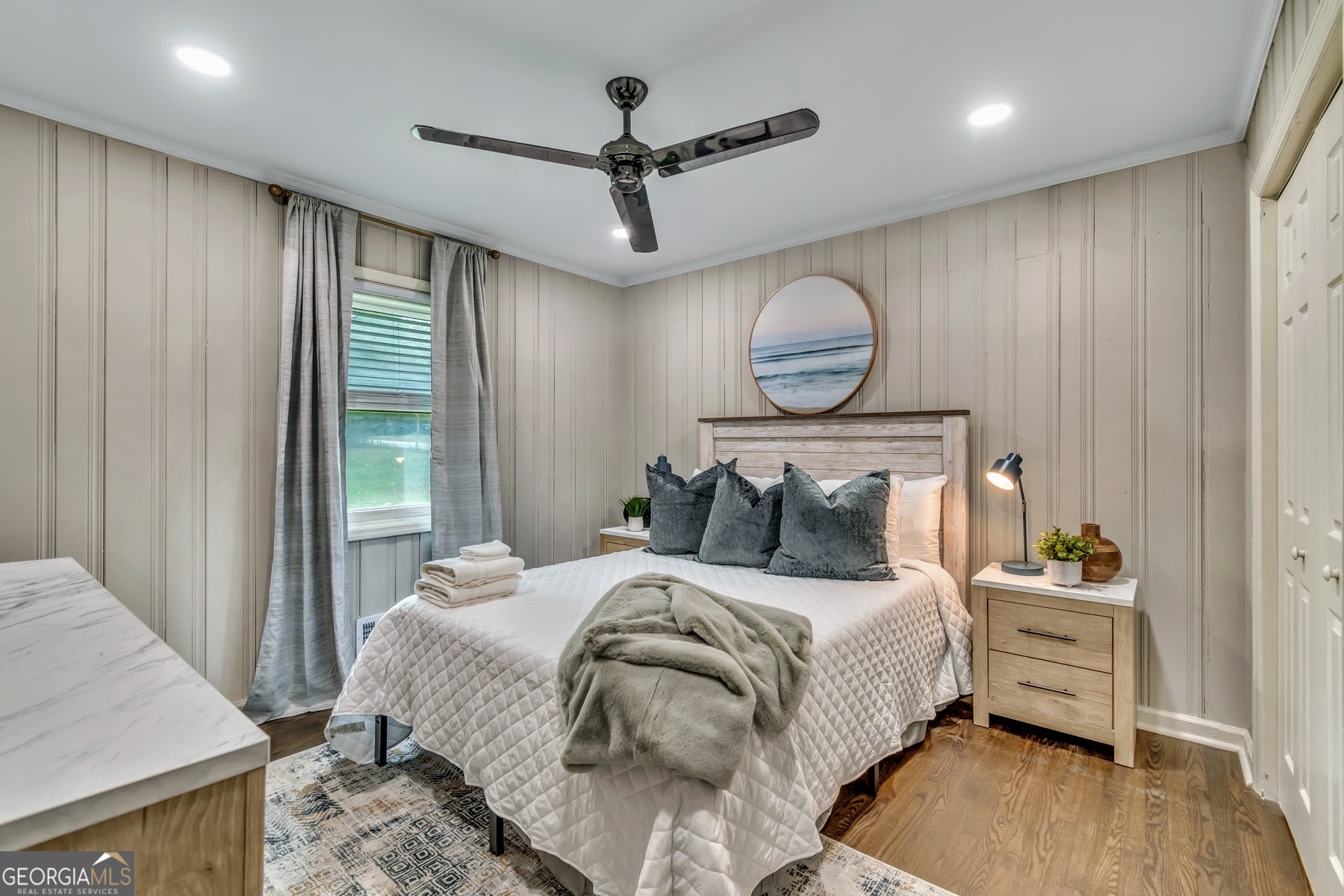 597 South Gordon Road Southwest Mableton, GA 30126 - Photo 10 of 25 a bedroom with a bed and wooden floor