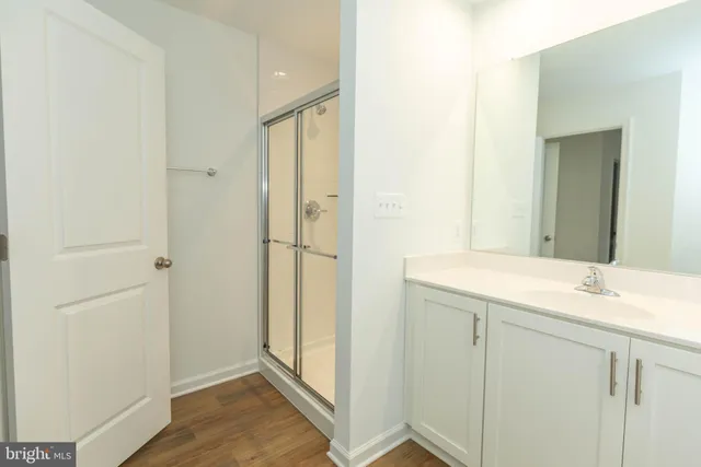 a bathroom with a toilet a sink and a shower