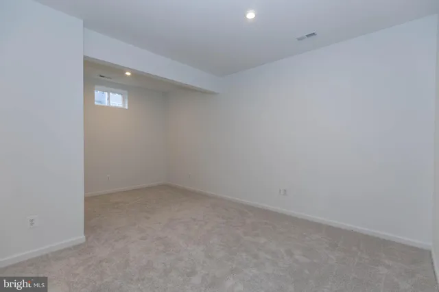 a view of an empty room and window