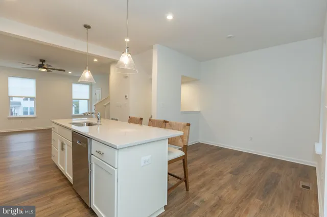 a kitchen with a stove and a sink