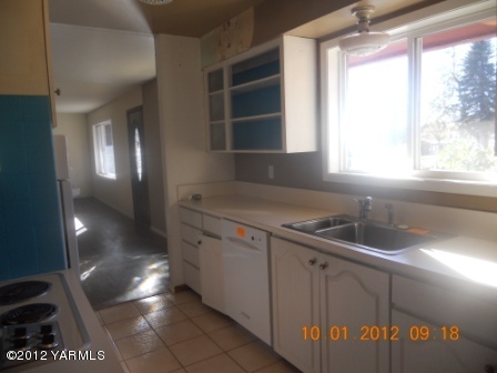 141 Ranger Road Naches, WA 98937 - Photo 2 of 6 a kitchen with a sink and a window