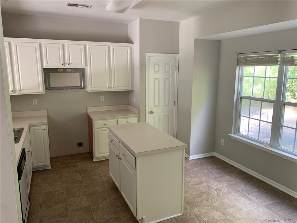 9730 Bailey Road Cornelius, NC 28031 - Photo 15 of 22 a utility room with cabinets washer and dryer