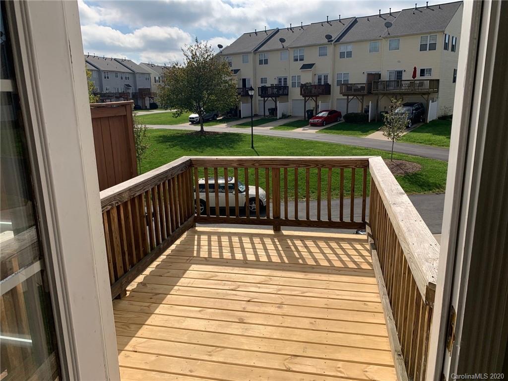 9730 Bailey Road Cornelius, NC 28031 - Photo 16 of 22 a view of balcony with deck and garden