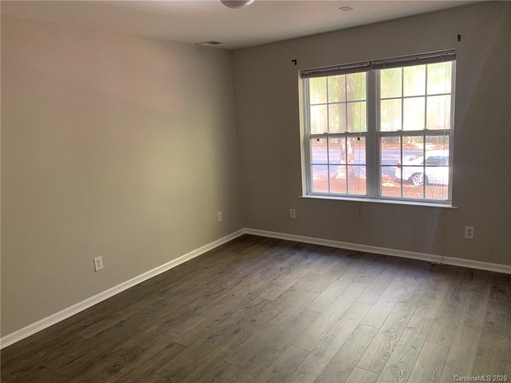 9730 Bailey Road Cornelius, NC 28031 - Photo 18 of 22 an empty room with wooden floor and windows