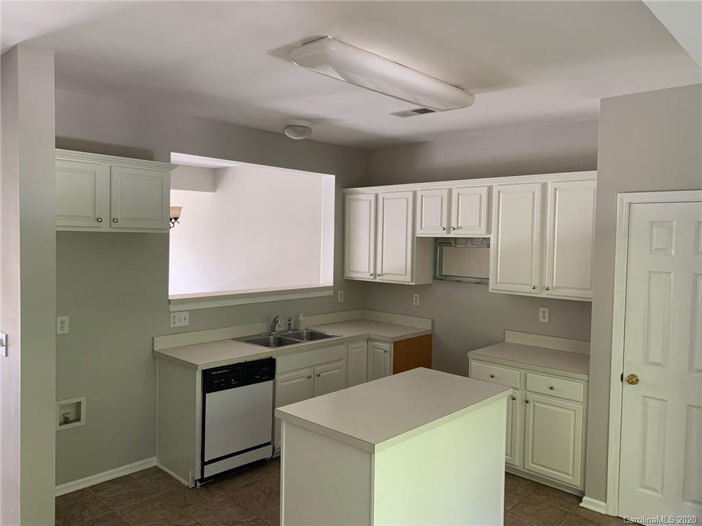 9730 Bailey Road Cornelius, NC 28031 - Photo 4 of 22 a kitchen that has a sink and a stove in it