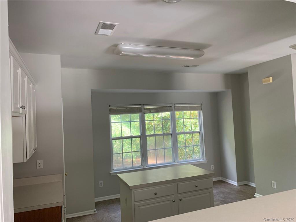9730 Bailey Road Cornelius, NC 28031 - Photo 5 of 22 a room with window and cabinet