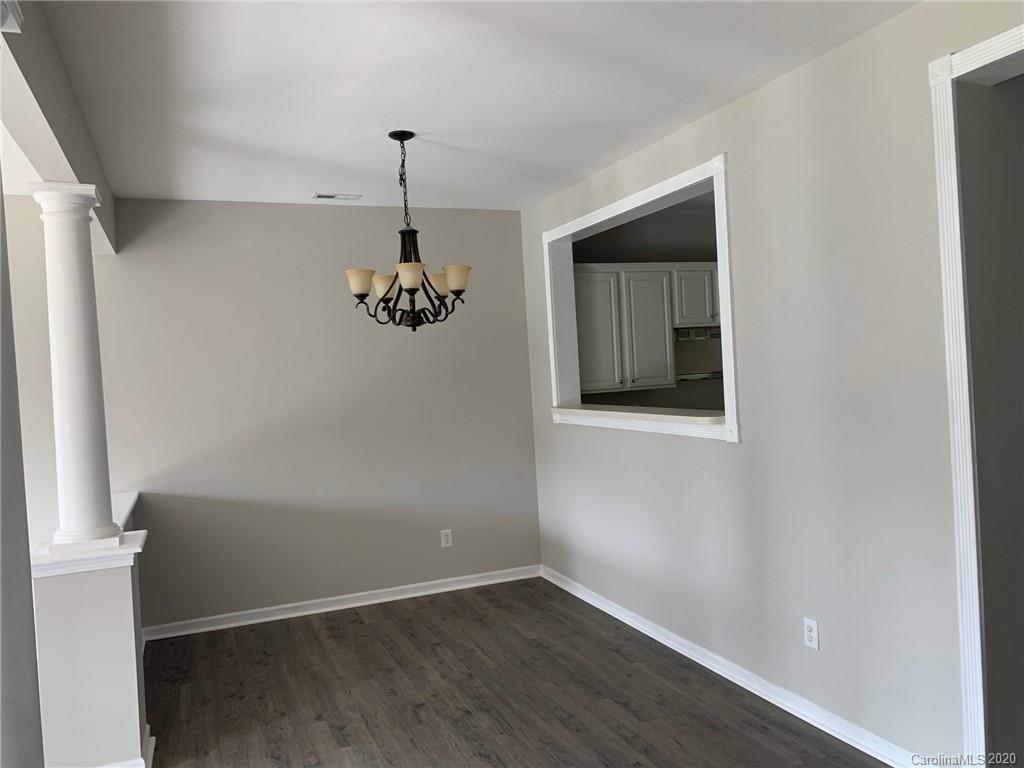 9730 Bailey Road Cornelius, NC 28031 - Photo 6 of 22 an empty room with wooden floor and windows