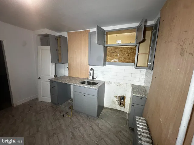 a room with a sink and a window