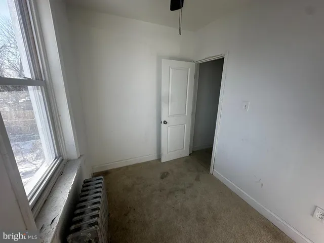 a view of room with window and stairs