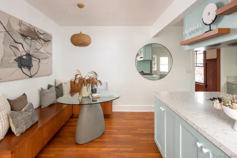a bathroom with a sink mirror and vanity